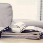 Photo of a pile of papers on a work desk