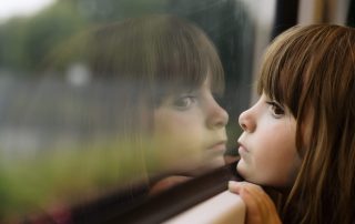 Photo of a girl looking out the window