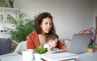 COVID-19 helpful tips if you are separated. Accompanying image: single mother nursing baby and looking for job online