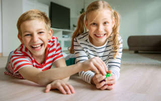 Image of two children, accompanying family law article "Shared parenting v parallel parenting"