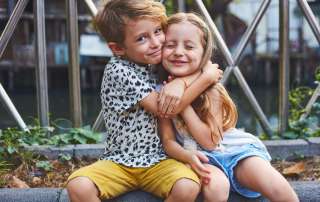 Image of two siblings accompanying family law article "Relocating with the kids – the difference between interim and final orders"