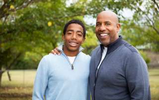 Image of father and his son accompanying family law article "What is adult child maintenance?"